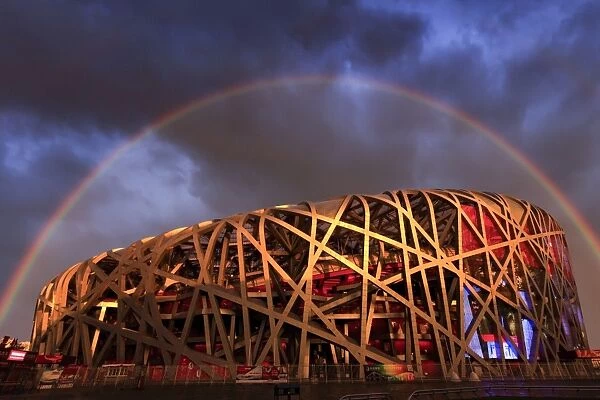 China, Beijing, Olympic park and famous birds nest stadium made of steel illuminated