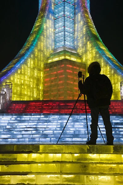 China, Heilongjiang, Harbin, Ice and Snow Festival, Photographer Silhouette at Ice