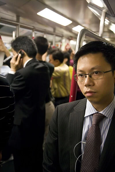 China, Hong Kong, commuters inside a busy Metro train