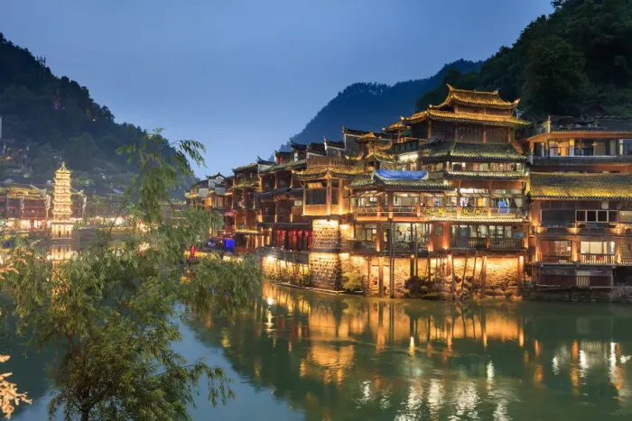 Framed Print : China, Hunan province, Fenghuang, riverside houses by night reflecting in the river Framed Print : China, Hunan province, Fenghuang, riverside houses by night reflecting in the river