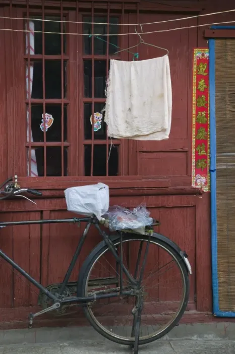 Framed Print : China, Yunnan Province, Dali, Old Town, Bicycle and wall Framed Print : China, Yunnan Province, Dali, Old Town, Bicycle and wall