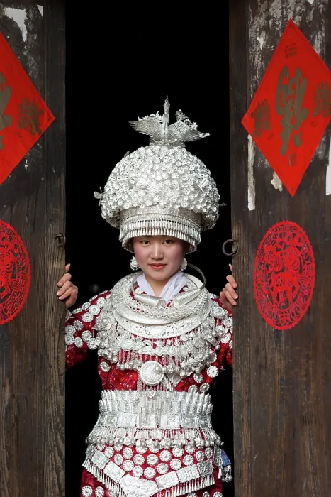 Framed Print : China, Zhonghua, Guizhou, Miao woman dressed in traditional costume, wearing a hat that weighs 5 kgs Framed Print : China, Zhonghua, Guizhou, Miao woman dressed in traditional costume, wearing a hat that weighs 5 kgs