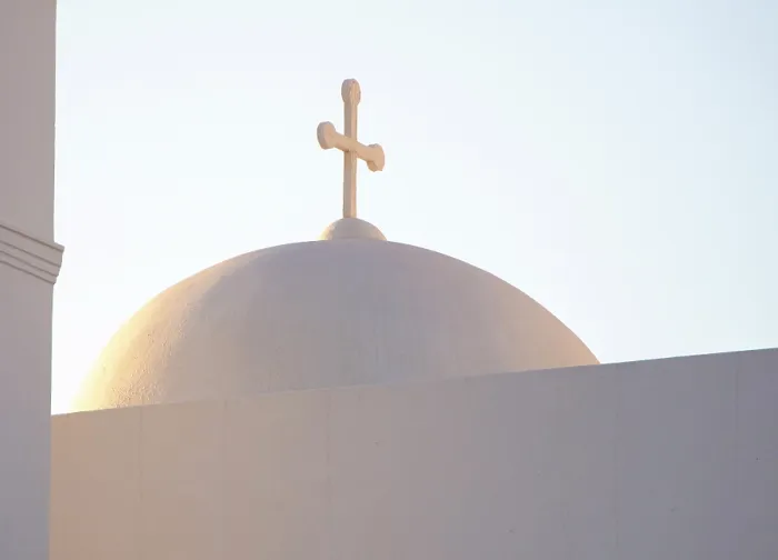 Framed Print : Church dome and cross at sunset, Oia, Santorini, Cyclades Islands, Greece, Europe