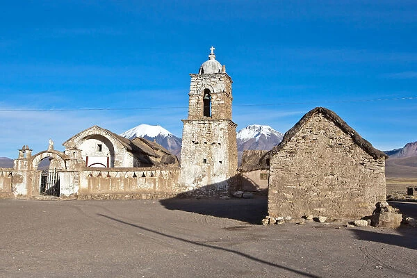 The church of Sajama and volcano Parinacota and Pomerape (Les Nevados de Payachatas)