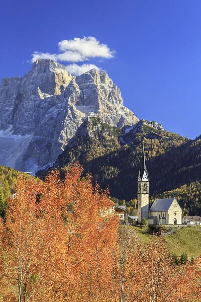 Church of Selva of Cadore with Mount Pelmo in the background in autumn. Dolomites