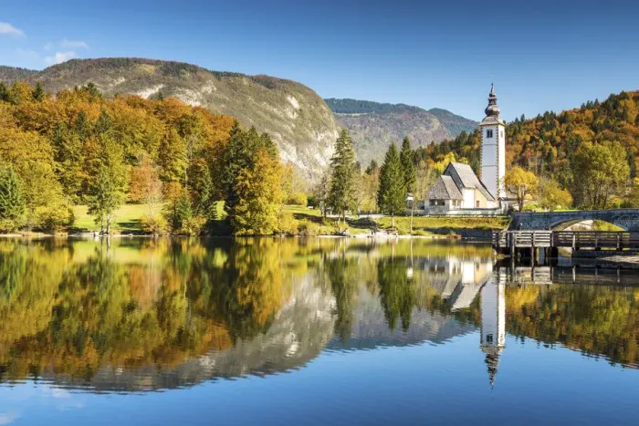 Framed Print : Church of St. John the Baptist reflecting in Lake Bohinj, Slovenia, Europe Framed Print : Church of St. John the Baptist reflecting in Lake Bohinj, Slovenia, Europe