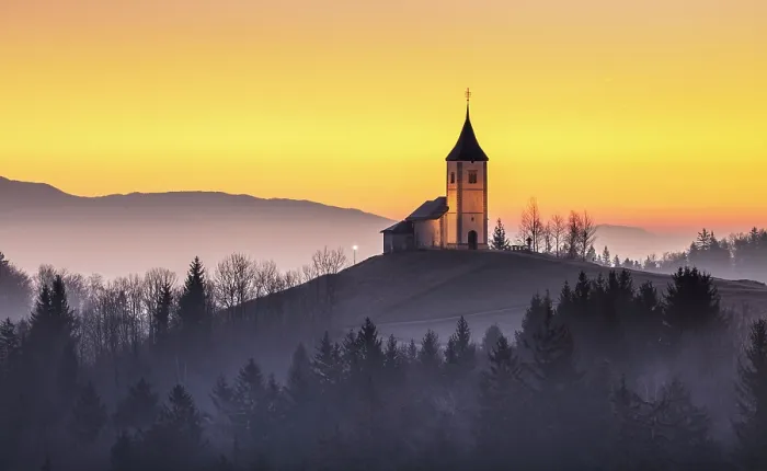 Framed Print : Church of St. Primoz and Felician against a golden sky at dawn, in winter, Jamnik, Slovenia Framed Print : Church of St. Primoz and Felician against a golden sky at dawn, in winter, Jamnik, Slovenia