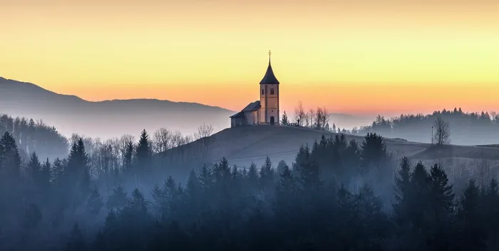 Framed Print : Church of St. Primoz and Felician against a golden sky at dawn, in winter, Jamnik, Slovenia Framed Print : Church of St. Primoz and Felician against a golden sky at dawn, in winter, Jamnik, Slovenia