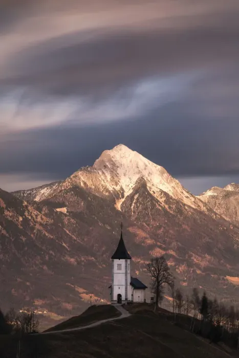 Framed Print : Church of St. Primoz and Storzic Mountain at sunset, Slovenia Framed Print : Church of St. Primoz and Storzic Mountain at sunset, Slovenia
