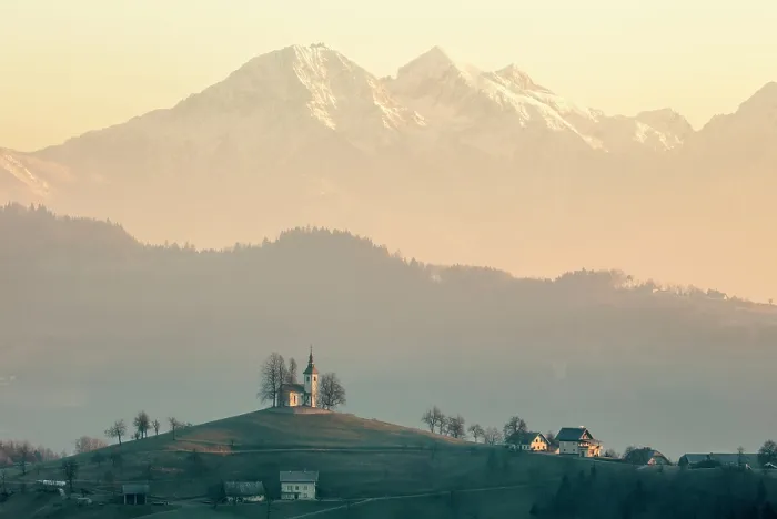 Framed Print : Church of St. Thomas and the Kamink Savinja Alps, Skofja Loka, Slovenia Framed Print : Church of St. Thomas and the Kamink Savinja Alps, Skofja Loka, Slovenia
