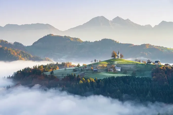 Framed Print : Church of St. Thomas and the Kamink Savinja Alps in winter, Skofja Loka, Slovenia