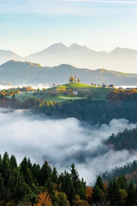 Framed Print : Church of St. Thomas and the Kamink Savinja Alps in winter, Skofja Loka, Slovenia