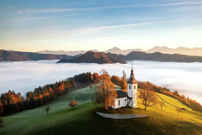 Framed Print : Church of St. Thomas and the Kamink Savinja Alps in winter, Skofja Loka, Slovenia Framed Print : Church of St. Thomas and the Kamink Savinja Alps in winter, Skofja Loka, Slovenia