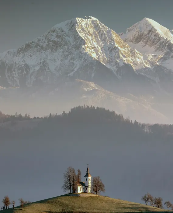 Framed Print : Church of St. Thomas and the Kamink Savinja Alps in winter, Skofja Loka, Slovenia Framed Print : Church of St. Thomas and the Kamink Savinja Alps in winter, Skofja Loka, Slovenia