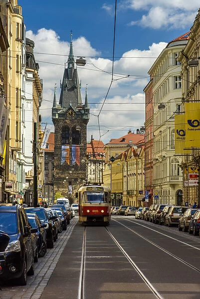 City centers street with tram and Henrys Tower in the background