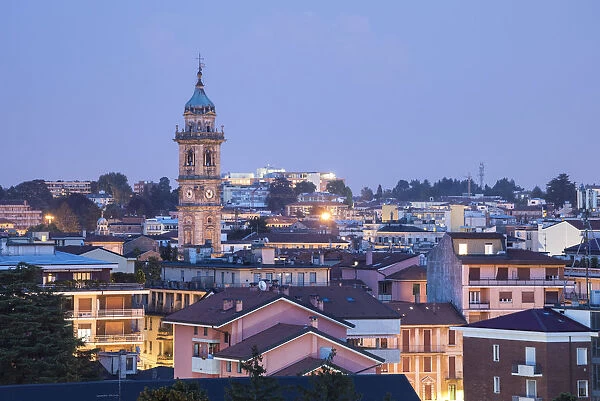 Cityscape and bell tower of San Vittore in Varese at dusk, Varese, Lombardy, Italy