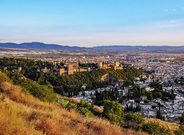 Cityscape with elevated view of Alhambra, sunset, Granada, Andalusia, Spain