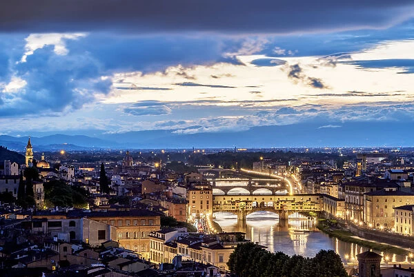 Cityscape with Ponte Vecchio and Arno River at dusk, Florence, Tuscany, Italy
