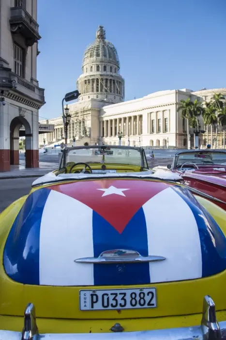 Framed Print : Classic American car with the Cuban flag painted in its boot, Parque Central, Havana
