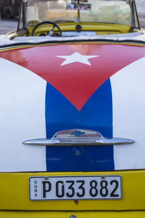 Framed Print : Classic American car with the Cuban flag painted in its boot, Parque Central Framed Print : Classic American car with the Cuban flag painted in its boot, Parque Central