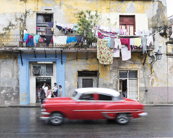classic american car passes old buildings, Havana, la habana, Cuba