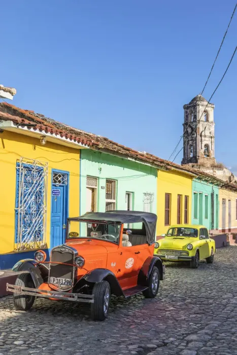 Framed Print : A classic car driving in a street in Trinidad, Sancti Spiritus, Cuba