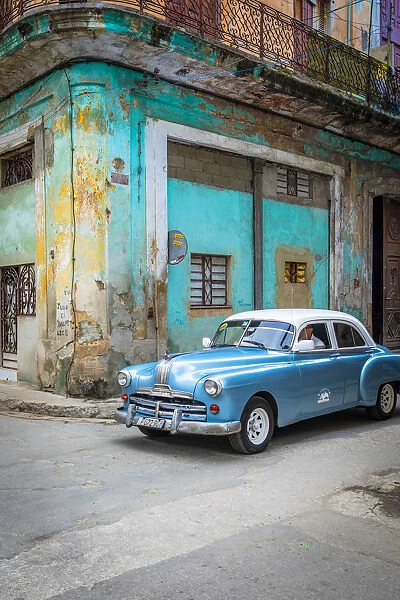 Classic car in a narrow street in La Habana Vieja (Old Town), Havana, Cuba