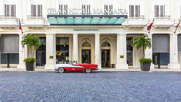 Classic car parked in front of the Grand Hotel Manzana in Centro Habana Province, Havana