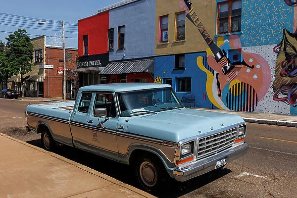 Classic Ford pick up and colourful buidings, Clarksdale, Mississippi, USA