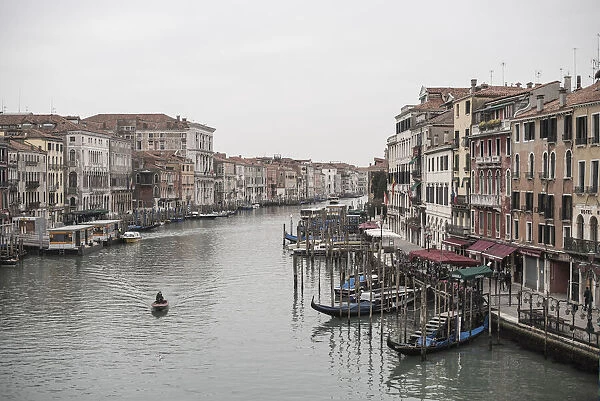 Classic view of the Canal Grande from the Ponte di Rialto during a gloomy winter day