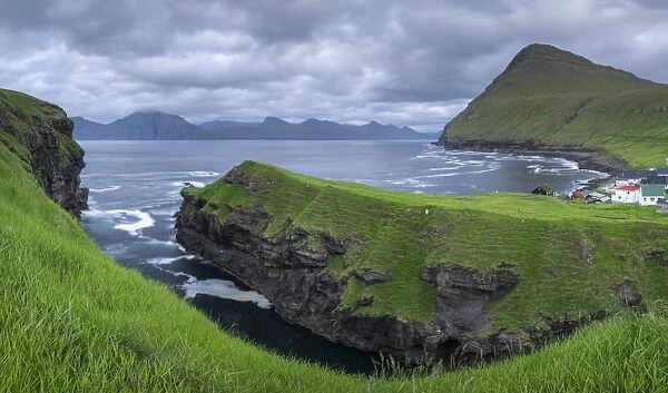 Cliff top view over the gorge at Gjogv towards the island of Kalsoy, Eysturoy, Faroe Islands