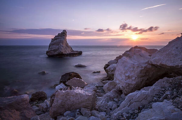 Cliffs and sea framed by the pink sky at sunrise La Vela Beach Portonovo province