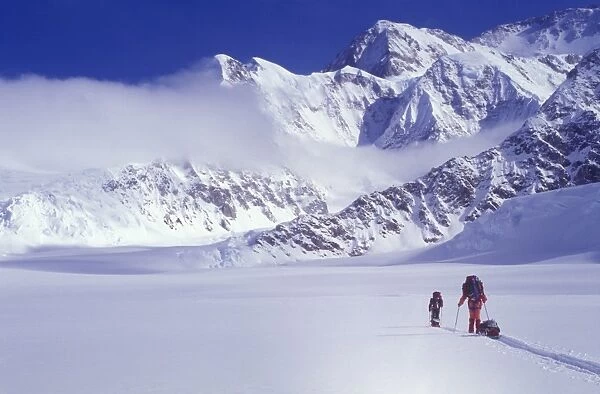 Climbers ski up the Kahiltna Glacier towards Mount McKinley