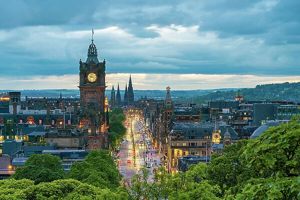 Clock tower of Balmoral Hotel, high angle view of Princes Street and St Marys Cathedral in background at dusk, UNESCO, Old Town, Edinburgh, Lothian, Scotland, UK
