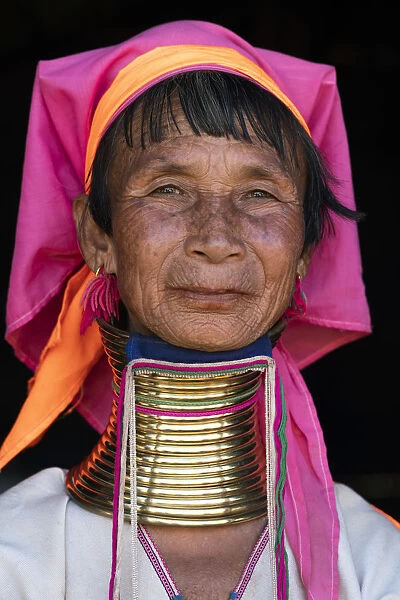 Close-up portrait of senior Kayan woman wearing traditional brass neck rings