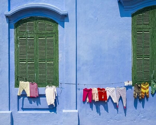 Clothes hung out to dry on a blue wall, Hoi An, Quang Nam Province, Vietnam