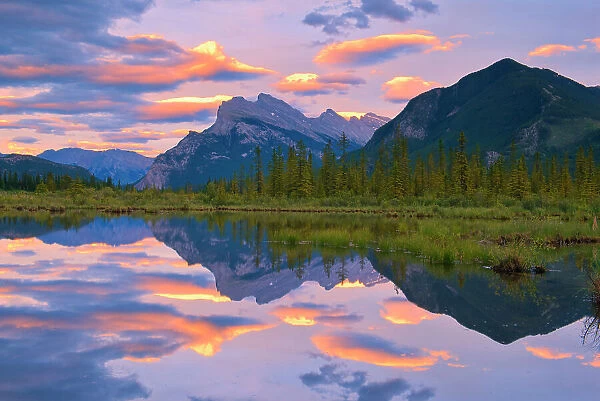 Clouds and Mt. Rundle and Sulphur Mountain reflected in Vermillion Lakes at sunset, Banff National Park, Alberta, Canada