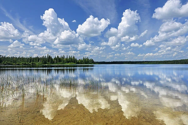 CLouds reflected in Burnfield Lake. Obatanga Provincial Lake, Ontario, Canada