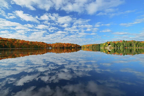 Clouds reflected in Horseshoe Lake. Autumn Near Parry Sound, Ontario, Canada