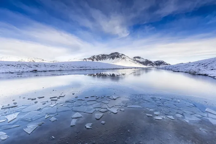 Framed Print : Clouds is reflected in the icy surface of alpine lake. Stelvio pass, Valtellina, Lombardy Framed Print : Clouds is reflected in the icy surface of alpine lake. Stelvio pass, Valtellina, Lombardy