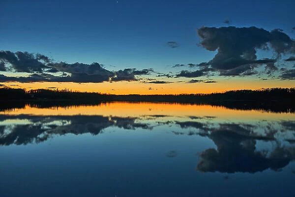 Clouds reflected in Klotz Lake at dusk Klotz Lake near Longlac Ontario, Canada