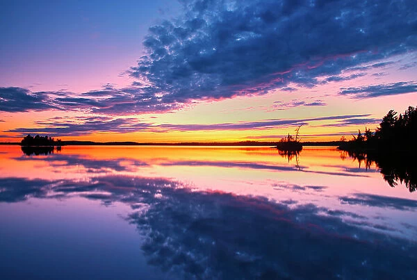 Clouds reflected in Lac-aux-Sables at sunset Belleterre Quebec, Canada