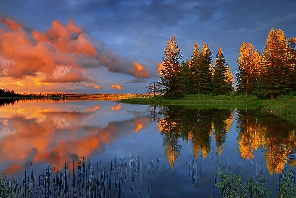 Clouds of stormy sky reflected in Whirlpool, Lake Riding Mountain National Park, Manitoba, Canada Riding Mountain National Park, Manitoba, Canada