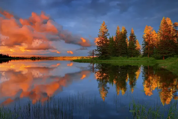 Framed Print : Clouds of stormy sky reflected in Whirlpool, Lake Riding Mountain National Park, Manitoba, Canada Riding Mountain National Park, Manitoba, Canada