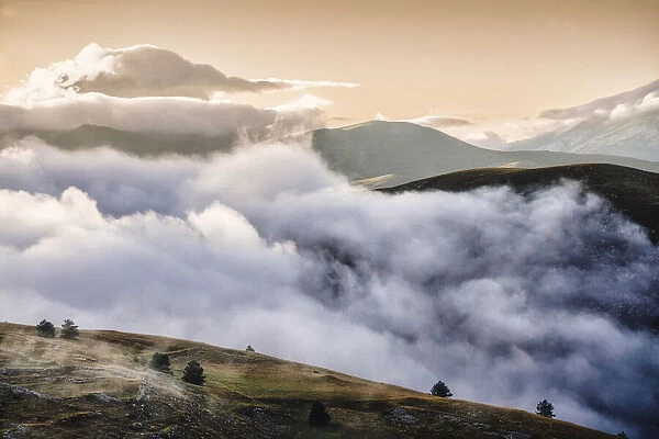 Cloudscape and wild landscape in Abruzzo, Italy. Hills at sunset