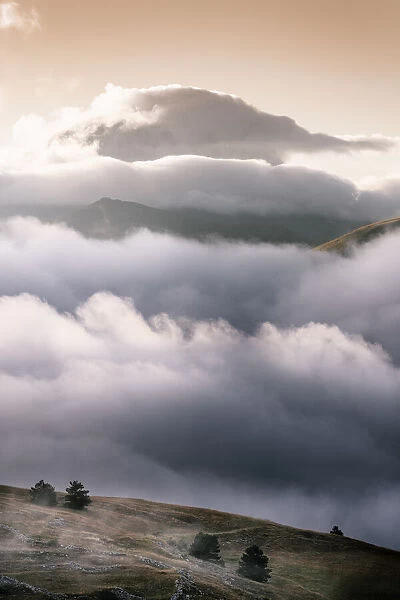Cloudscape and wild landscape in Abruzzo, Italy. Hills at sunset