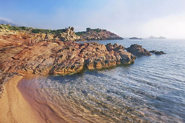 Coast landscape with mist at Punta Capaccia - Italy, Sardinia, Olbia-Tempio