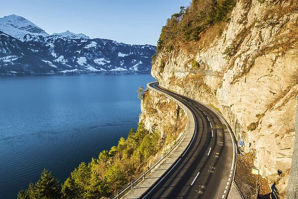 Coastal road on Lake Thun, Berner Oberland, canton of Bern, Switzerland