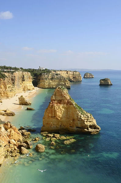 The coastal rock formations at Marinha beach (Praia da Marinha). Algarve, Portugal