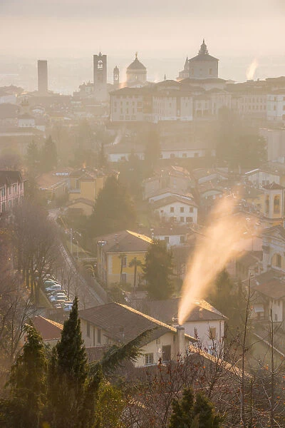 A cold morning in Bergamo upper town with some fog and smoke from the chimneys